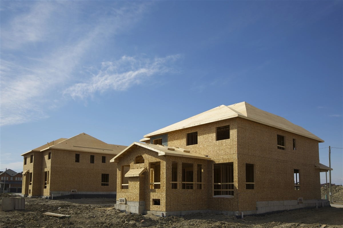 picture of residential home under construction under blue skies